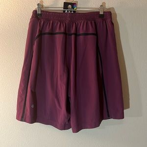 #26 Lululemon Surge lined 9" inseam shorts in plum men’s large